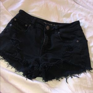 distressed black American Eagle shorts